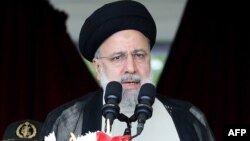 Iranian President Ebrahim Raisi attends a military parade alongside high-ranking officials and commanders during a ceremony marking the country's annual National Army Day in Tehran on April 17.