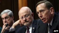 U.S.Director of National Intelligence James Clapper (center) and CIA Director David Petraeus (right) appear before with FBI Director Robert Mueller (left) before a Senate Select Committee on Intelligence in Washington on January 31.