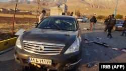 A photo made available by Iranian state TV shows the aftermath of a deadly attack near Tehran that killed Iranian nuclear scientist Mohsen Fakhrizadeh on November 27.