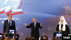 Министр иностранных дел России Сергей Лавров, президент России Владимир Путин и патриарх Московский и всея Руси Кирилл