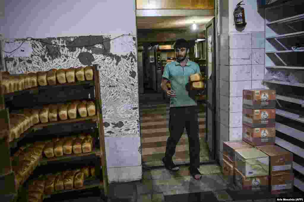 Loaves awaiting pickup in the bakery. The bakery also operates a delivery service for those who are unable to pick up the bread themselves. One driver said: "We deliver every day, whatever time people ask us to, at least six to eight times a day.... Danger is everywhere but we try to deliver wherever we can."