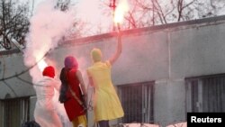 Members of the radical feminist group Pussy Riot performing in support of detained opposition activists in December.