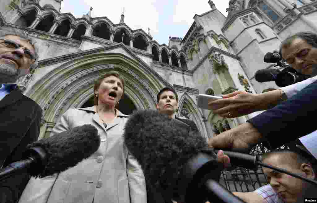 Marina Litvinenko speaks to the media as she leaves the High Court in London on July 12, 2013, amid calls for a public inquiry into her husband's death.