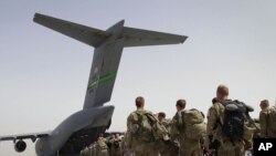The first withdrawal involved about 650 U.S. ground troops deployed northwest of the capital, Kabul.