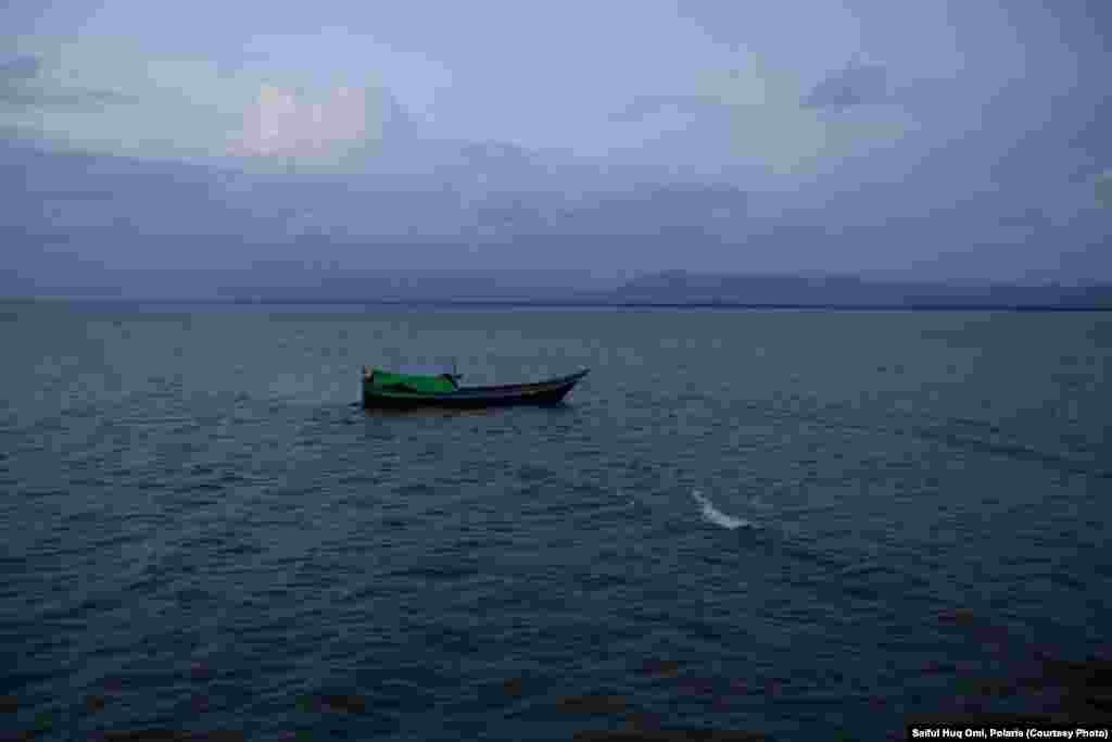 The Muslim Rohingya refugees from Burma attempt to get into neighboring Bangladesh by crossing the wide estuary of the Naf River, which marks the border between the two countries.  