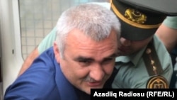 Afqan Muxtarli is brought to court in Baku in June.