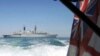 Britain Freezes Talks With Iran