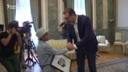 Refugee 'Little Picasso' Gives Portrait To Serbian President Refugee 'Little Picasso' Gives Portrait To Serbian President