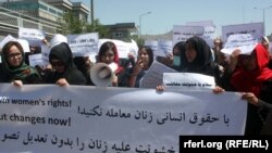 Afghan activists hold a rally outside the parliament in Kabul earlier this year in support of a law outlawing violence against women. A new organization hopes to consolidate civil society's burgeoning role in Afghanistan.