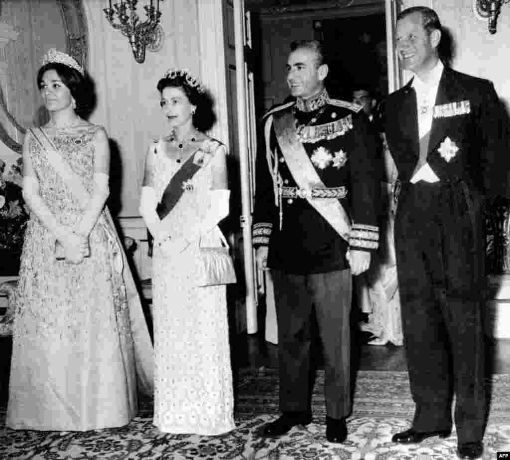 Queen Elizabeth II and Prince Philip of the United Kingdom pose with the shah and his wife, Farah, during their state visit to Iran in March 1961. 