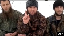 Islamist insurgent leader Doku Umarov (center) recorded his appeal in an undisclosed location.