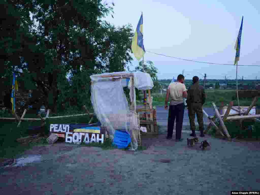 Puppies squeal and fight as night falls over the camp. A blockade leader told RFE/RL the activists want the more than 100 Ukrainians currently held prisoner in the separatist regions released before June 11 or their unspecified "action" will commence.