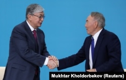 Then-interim President Qasym-Zhomart Toqaev and former President Nursultan Nazarbaev in Nur-Sultan on April 23, 2019.