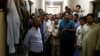Foreign workers gather to speak to journalists at the Qadisiya labor camp in Saudi Arabia. (file photo)