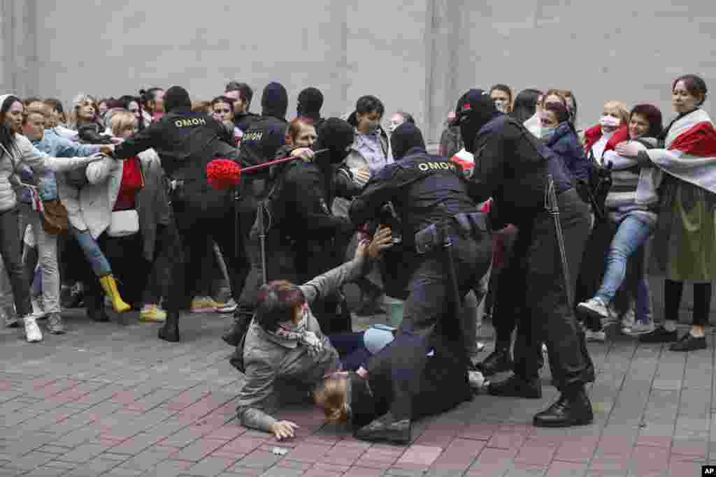 Police officers detained several women. 