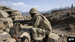 Soldiers secure a location on a hillside in South Waziristan