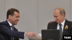 Russian President Vladimir Putin (right) with Dmitry Medvedev at a special session of the State Duma in Moscow, which confirmed the latter's appointment as prime minister.
