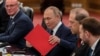 Russian President Vladimir Putin organizes documents at a bilateral meeting with Chinese leader Xi Jinping in Beijing on September 2.
