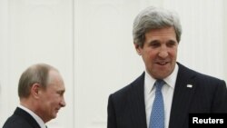 Russia's President Vladimir Putin (left) and U.S. Secretary of State John Kerry arrive for their meeting in Moscow on May 7.