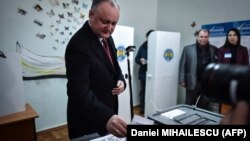 Moldovan President Igor Dodon casts his vote in parliamentary elections in a polling station in Chisinau on February 24.