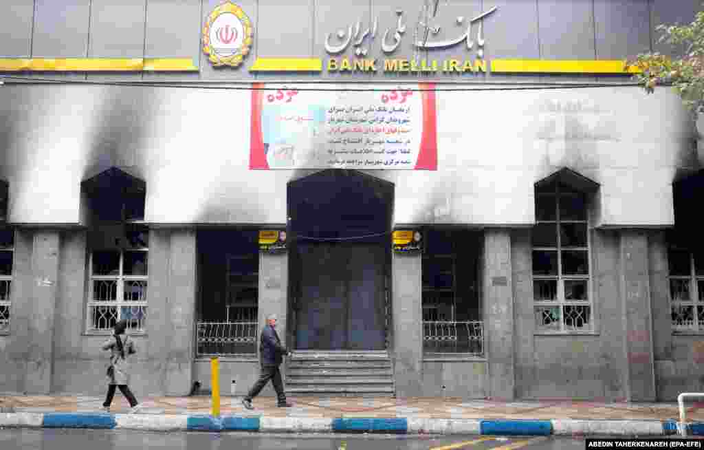 A branch of the Iranian national bank in Shahriar that was burned during the protests. Iran's government blamed the unrest on a "plot" from some of Tehran's foreign foes: Saudi Arabia, Israel, and the United States.