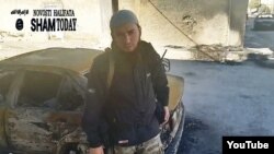 A screen grab from a video purportedly showing a Chechen militant in Syria exhorting his compatriots to join Islamic State.