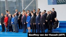 NATO heads of state pose for a group photo in Brussels on July 11.