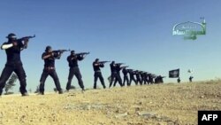 An image taken from a propaganda video uploaded to the Internet last year by Syria's Islamist Ahrar al-Sham group, showing its members taking part in a training session at an undisclosed location in Syria. Ahrar al-Sham has since merged with other Islamist factions to form the Islamic Front.