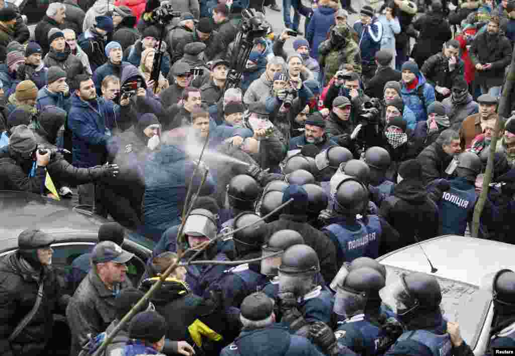 Tear gas or pepper spray being used against protesters during the standoff. 