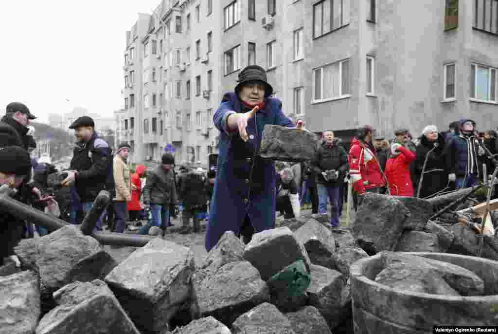 Saakashvili's supporters move paving stones during a standoff with police in Kyiv on December 5.