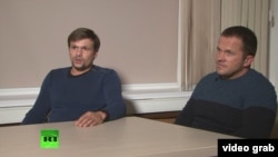 A screen grab from RT's interview with Aleksandr Petrov and Ruslan Boshirov to discuss claims made by London that they were involved in the poisoning of a former Russian spy and his daughter in Salisbury.