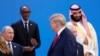 Дональд Трамп проходит мимо Владимира Путина, когда участники саммита «Группы двадцати» готовились к коллективной фотографии. Аргентина, Буэнос-Айресе, 30 ноября 2018 года