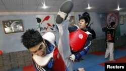 Nekpa (right) has complained about poor training conditions for taekwondo competitors in Afghanistan.