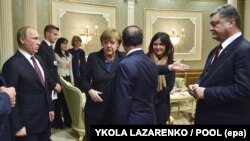 Встреча "Нормандской четверки" в Минске. Президент Украины Петр Порошенко, президент Франции Франсуа Олланд, канцлер Германии Ангела Меркель и президент России Владимир Путин. 11 февраля 2015 года.