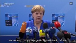 Merkel Defends Germany's NATO Record Merkel Defends Germany's NATO Record
