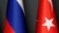 TURKEY -- Flags of Germany, Russia, Turkey and France are seen ahead of a news conference of Turkish President Tayyip Erdogan, Russian President Vladimir Putin, French President Emmanuel Macron and German Chancellor Angela Merkel after a Syria summit, in