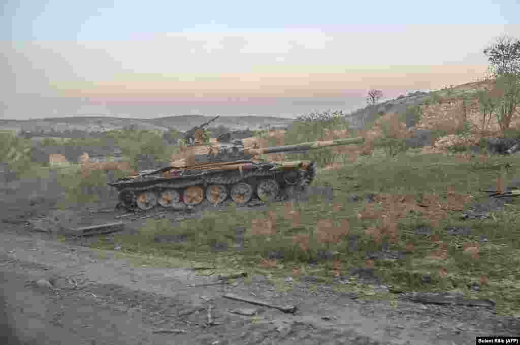 A destroyed tank in Jabrayil, after the town was captured by Azerbaijani forces, photographed from a passing car on October 16.  