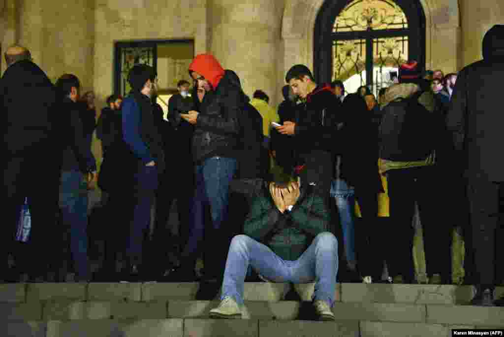 Crowds outside the parliament building in Yerevan. Protesters described feeling "betrayed" by the decision to end the fighting. More than 1,200 Armenian soldiers died in the latest war for Nagorno-Karabakh.