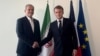French President Emmanuel Macron (right) meets Iranian counterpart Masud Pezeshkian in New York on September 24.