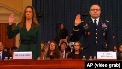 Lieutenant Colonel Alexander Vindman (right) and Jennifer Williams, a Foreign Service aide to U.S. Vice President Mike Pence, before the House Intelligence Committee in Washington on November 19.