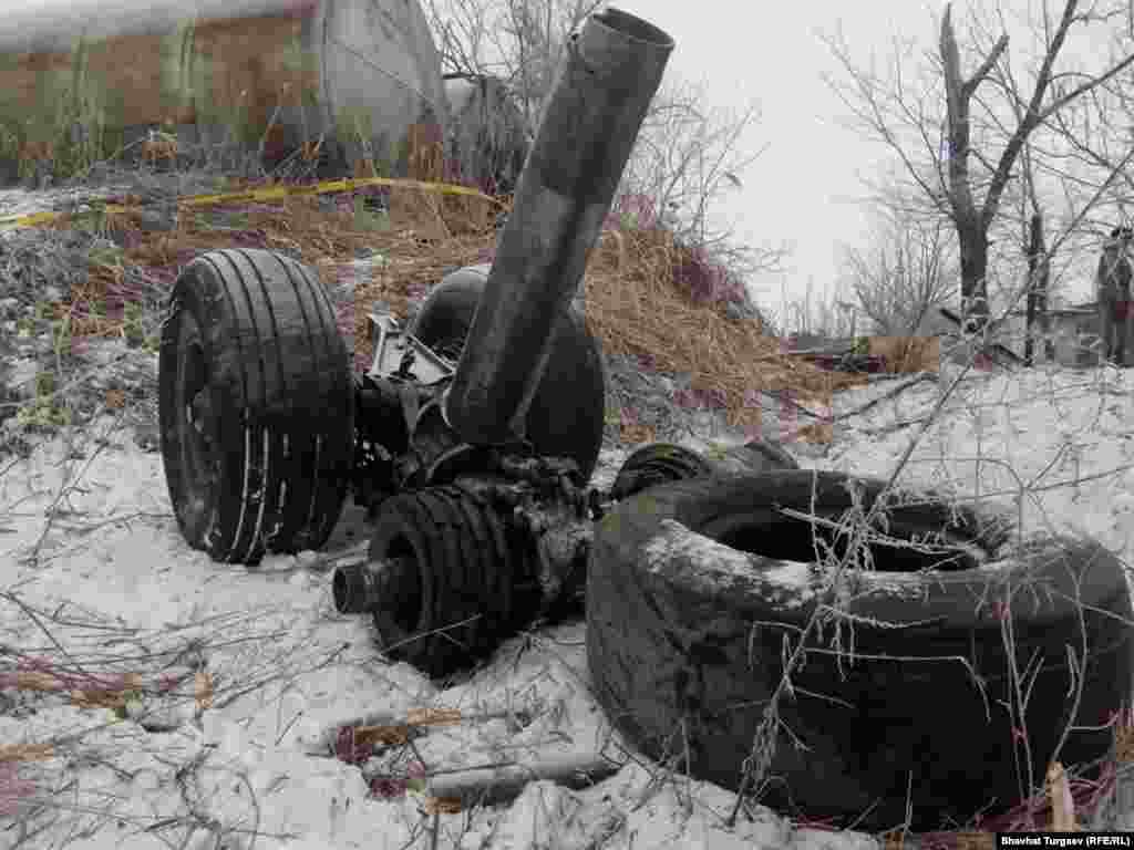 Landing gear lying in snow. Foggy weather is being cited as a possible factor in the crash. 