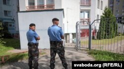 Belarusian police officers during a raid on the BelaPAN news agency in Minsk on August 7.