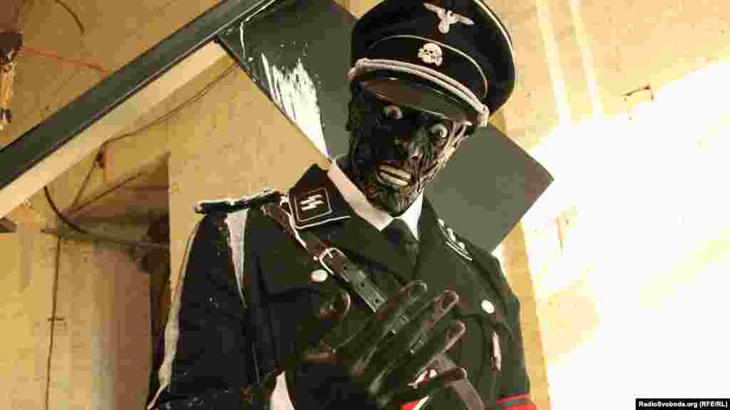 A detail from the eye-catching Nazi-themed installation "F**king Dinosaurs" by English brothers Jake and Dinos Chapman. 