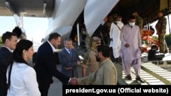Afghan refugees and Ukrainian citizens evacuated from Kabul arrive in Kyiv in August 2021.