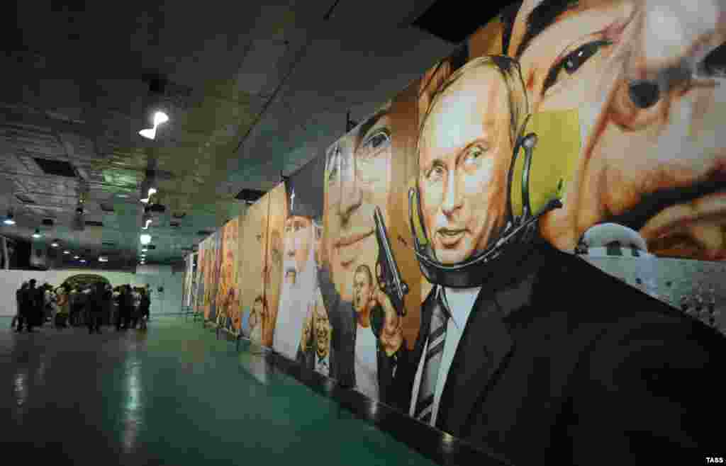 A painting on display during an exhibition titled "Rodina" in Novosibirsk