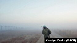 A trooper patrols along the Afghan-Tajik border.
