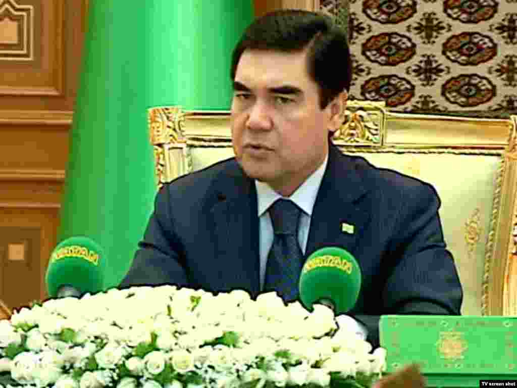 Berdymukhammedov at a cabinet meeting. The Turkmen president is frequently shown against a foreground of white roses, and is even the subject of an adulatory poem entitled "White Roses."