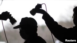A man is tested for possible nuclear radiation at an evacuation center in Fukushima
