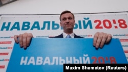 Russian opposition leader Alexei Navalny attends a meeting to uphold his bid for to run as a presidential candidate, in Moscow on December 24.