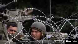 NATO peacekeepers patrol in Mitrovica after the deadly explosion